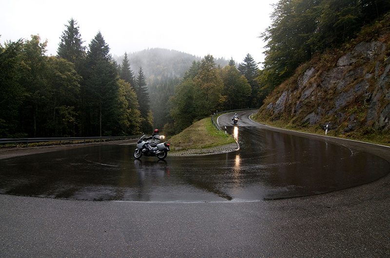 Motorcycle touring in rain hairpin